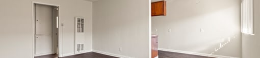 A room with a ceiling fan and a brown floor.