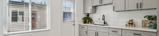 A kitchen with a logo for Beach Front Property Management.