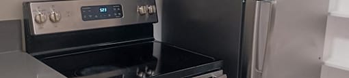 a kitchen with a stove and a refrigerator
