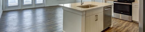 kitchen with a view of living room at Brixton South Shore, Austin, TX, 78741