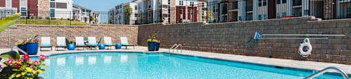 our apartments have a large swimming pool with lounge chairs