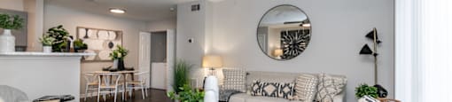 a living room with a couch and a ceiling fan
