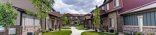 a view of a park with a fountain at Arcadia Townhomes, Roy, UT 84067