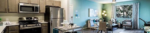 View of kitchen and living room at THE RISE APARTMENT HOMES, Las Vegas