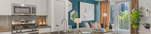 A modern kitchen with a dining table and chairs.