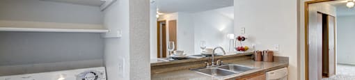 A white oven is in a kitchen with wooden cabinets.