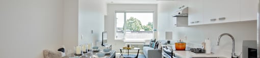 a kitchen and living room in a 555 waverly unit