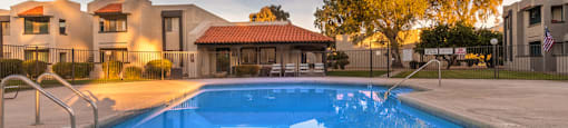 Riverstone pool view with nice view, and lounging area nearby