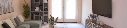 Spacious living area with a ceiling fan and plush carpeting