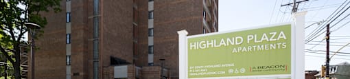 Property Exterior at Highland Plaza Apartments, Pittsburgh, PA. Monument Signage.