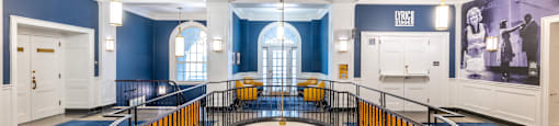 the interior of a building with a circular staircase and blue walls and white ceilings  at 140 Clarendon, Massachusetts, 02116