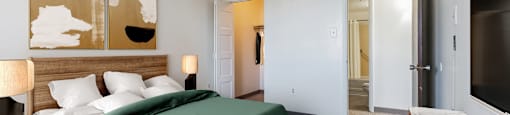 a bedroom with a bed and a desk in a room at Montani Towers, Wheeling