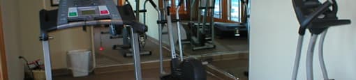 A well-equipped fitness center at Cedar Ridge Apartments.