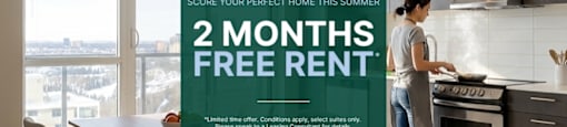 A woman is cooking in a modern kitchen with a sign offering 2 months free rent.