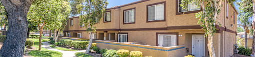 our apartments offer a walkway to the side of our building with trees