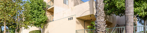 an apartment building with the address 385 on the side of the building