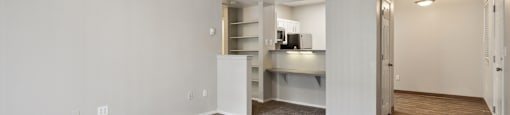 the living room and kitchen of an apartment