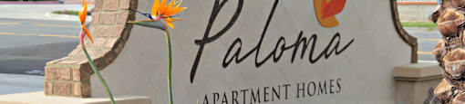 the sign for paloma apartment homes at the entrance of the property
