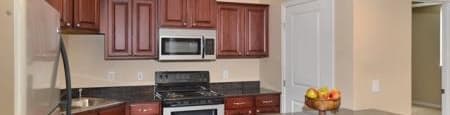 a kitchen with a center island and a stove top oven