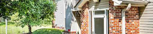 Cozy Exterior with Plants and greenery  at Deer Park Apartments in Council Bluffs, IA