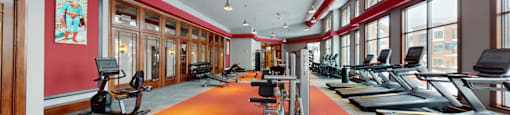 A gym with treadmills and exercise bikes.