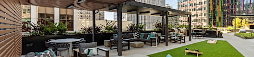 a lounge area with couches and tables on a patio