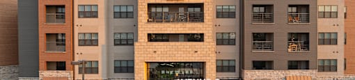 an exterior view of anaweel cc building at sunset at Avenue C Apartments, Billings, 59102