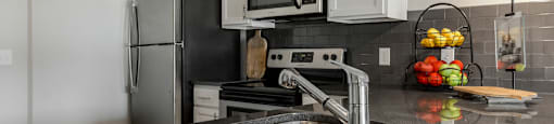 a kitchen with stainless steel appliances and a sink