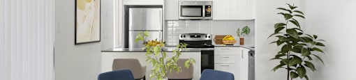 a kitchen and dining room with a table and chairs