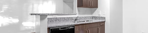 Kitchen with dishwasher at Cedar Grove Apartments in Miami Gardens FL