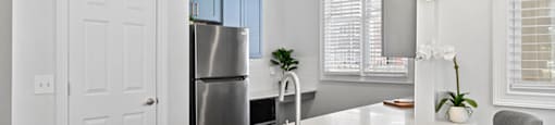 Kitchen with white countertops at Grand Oaks Apartments in Chester VA