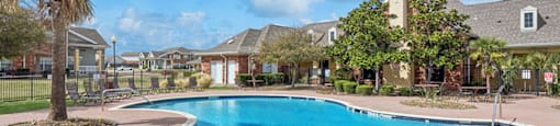 Swimming pool sun deck at Ironwood Crossing Apartments and Townhomes in Fort Worth TX