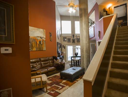 a view from the bottom of the stairs looking into the living room