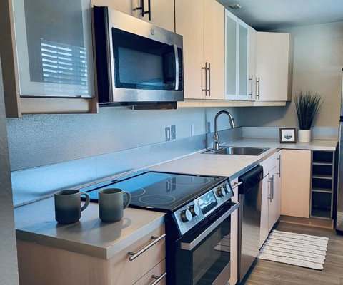 a kitchen with a stove and a microwave