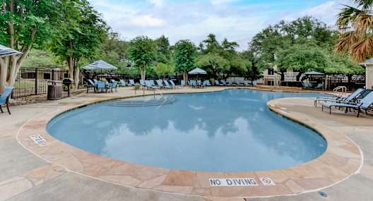 A pool with a "No Diving" sign in the middle.