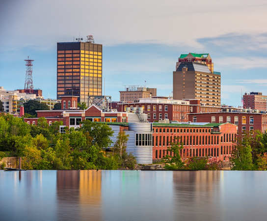 a view of the city of memphis from across a lake at Edgebrook Residences, Merrimack, NH 03054