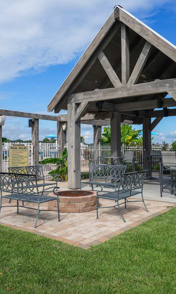 a patio with patio furniture and a pavilion with a fire pit at Lakeshore Pointe Apartment Homes, Brandon, MS