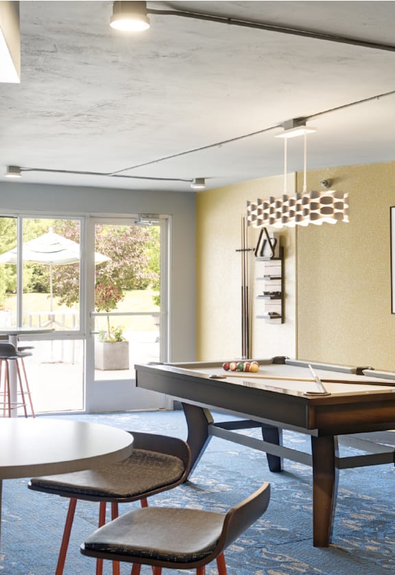 a game room with a pool table and a bar  at Pebblebrook Court, Minnesota, 55437