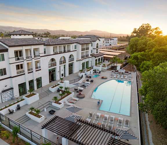 an aerial view of a hotel with a swimming pool at The Venue at Orange Apartments, Redlands, CA, 92373