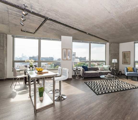 a living room with hardwood floors and large windows at Lakeview 3200 Apartments, Chicago, IL, 60657