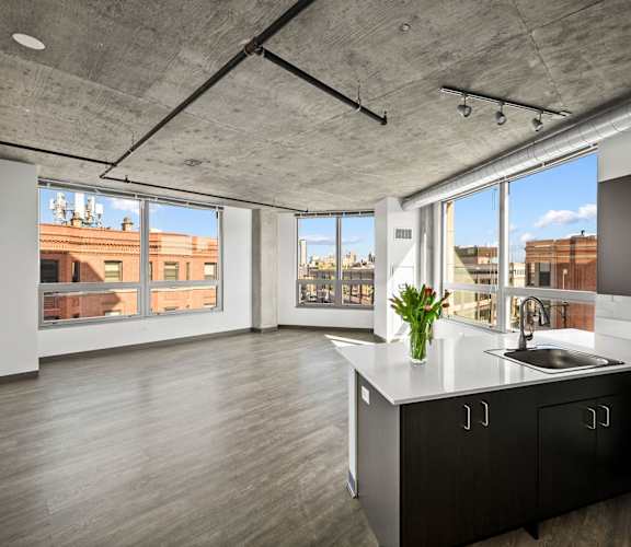 a kitchen with a large window and a view of a city at Lakeview 3200 Apartments, Chicago, IL, 60657