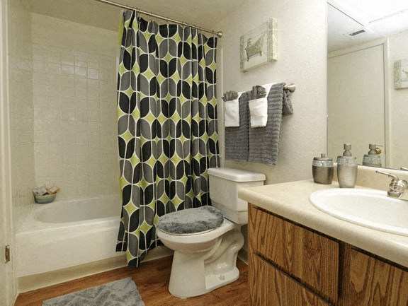 a bathroom with a toilet sink and bathtub