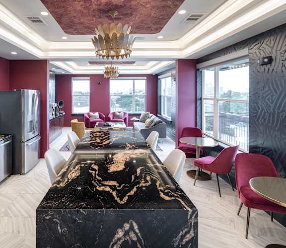 a kitchen and dining room with a large table and chairs at Gatsby on Ross, Dallas, Texas