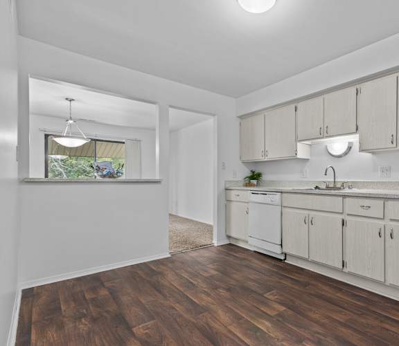 an empty kitchen with white appliances and white cabinets at Edge At Farmington Hills - Farmington Hills, MI, Michigan, 48334