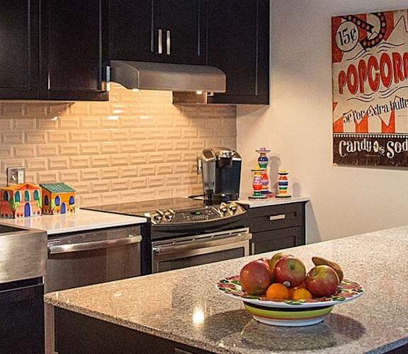 Kitchen with Countertops and Stainless Steel Appliances at The Malcomson, Detroit, 48226