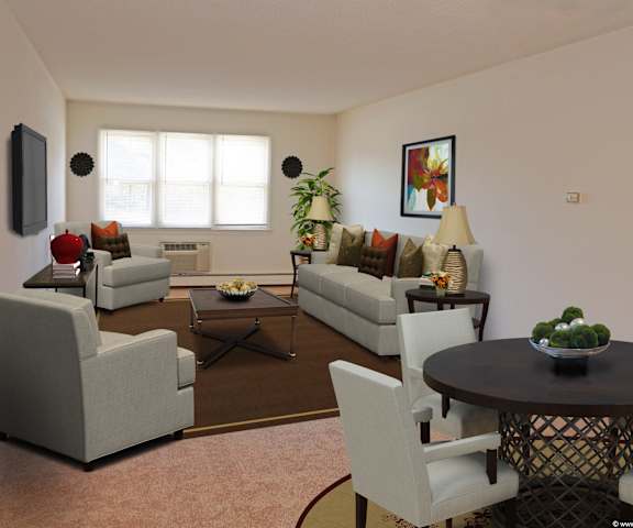 a living room with couches and chairs and a table