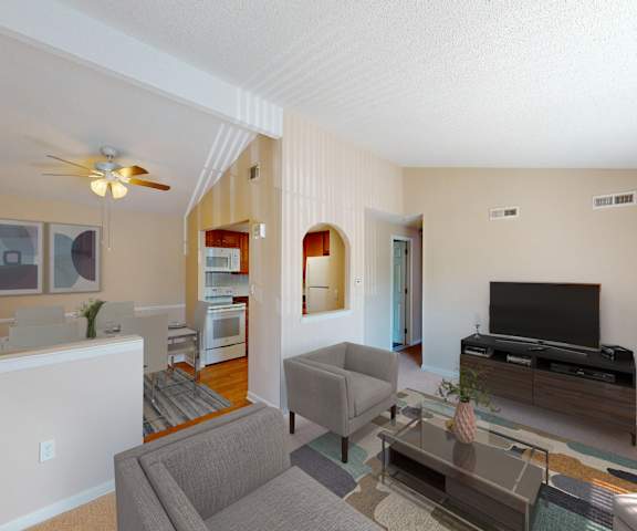 a living room with a couch and a tv