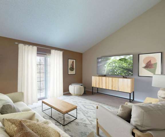 A living room with a large couch, a coffee table, and a lamp.