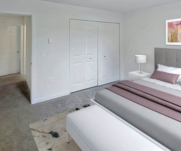 a bedroom with a bed and a closet