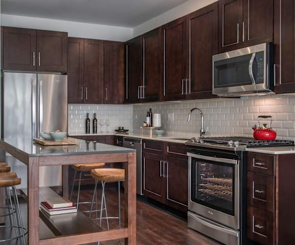 Modern kitchen with tiled backsplash - Kelmscott Park Apartments